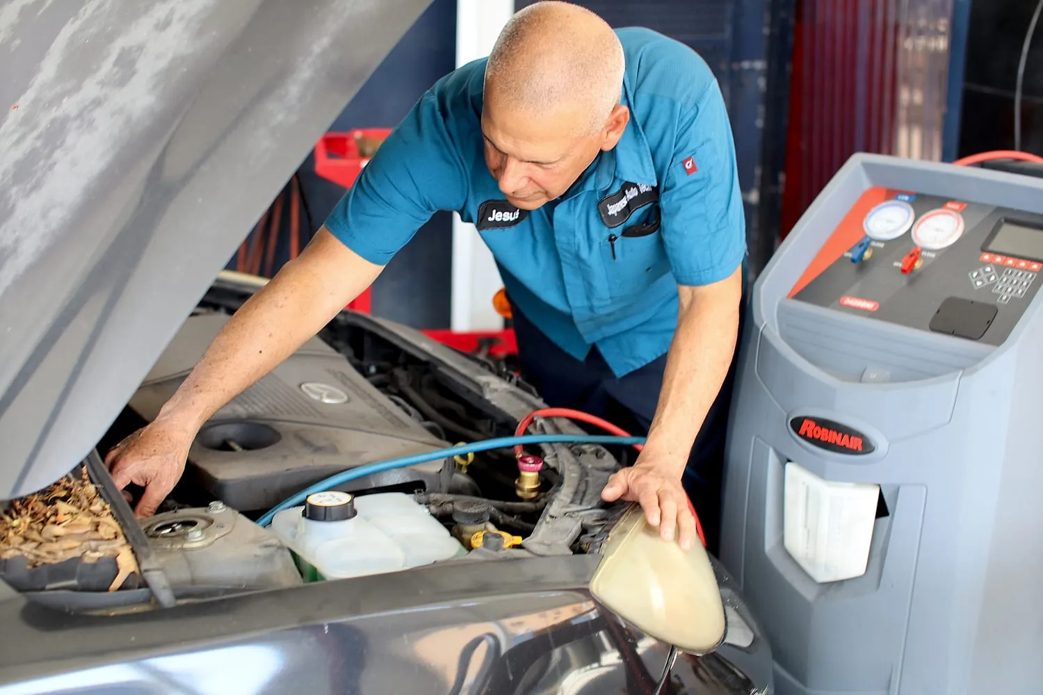 Technician performing conventional-system service at Japanese Auto Tech in Miami