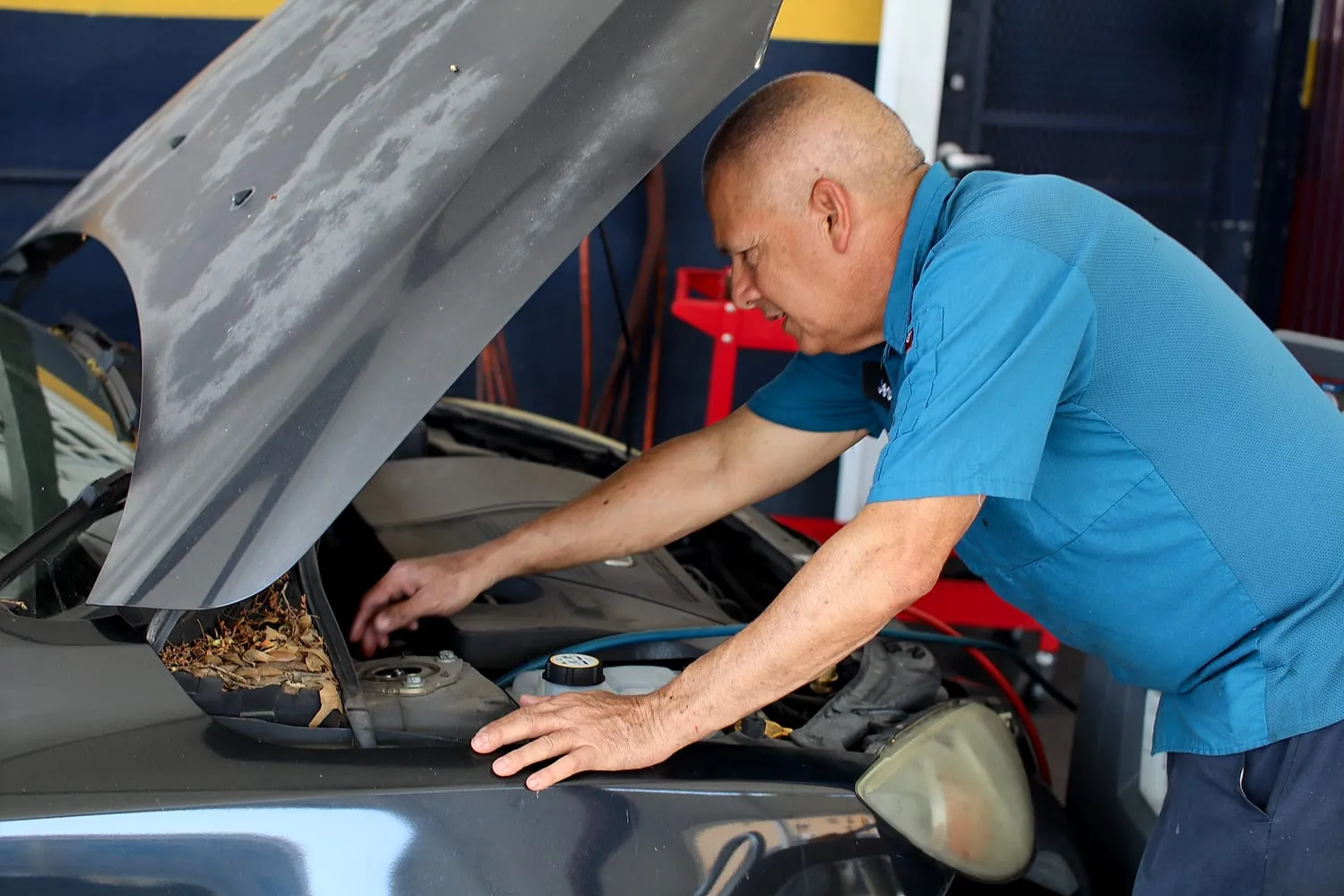 Technician diagnosing an engine at Japanese Auto Tech in Miami